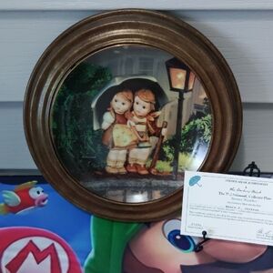 Hummel-Inspired Brown Decorative Wall Plate with Children Illustration